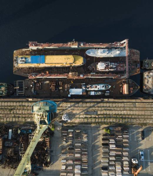 aerial view of various ships in industrial harbour