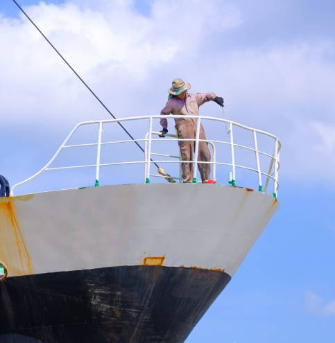 asian-worker-is-painting-balustrade-on-the-bow-of-2025-03-11-07-38-10-utc