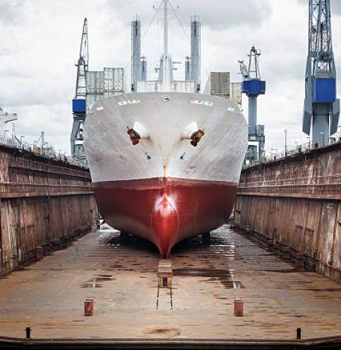 Commercial dock, wharf, ship and gantry crane, port of Rotterdam