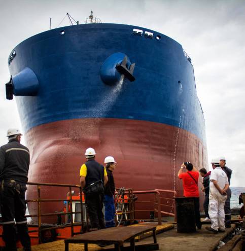 launching of renovated tanker cargo ship from dock to water