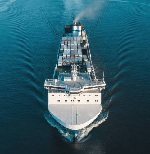 Aerial view of vehicles carrier in the sea